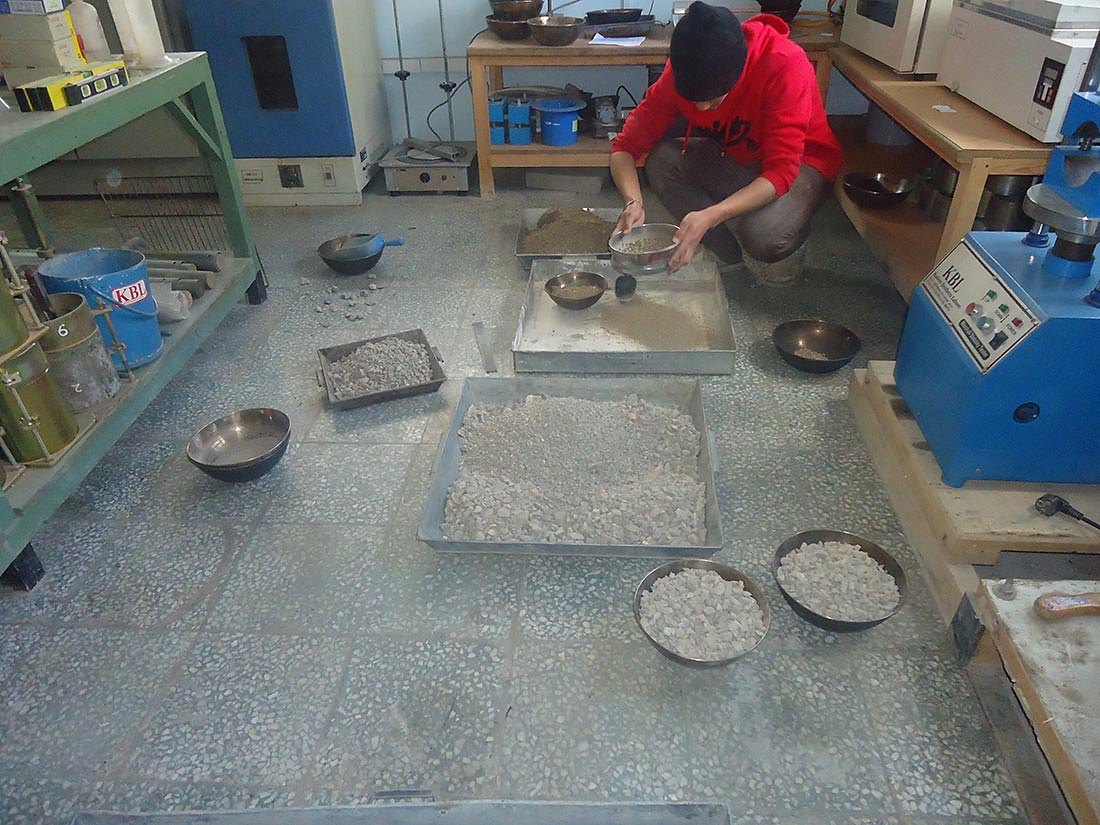 Technician testing aggregate samples in the Zurmat laboratory